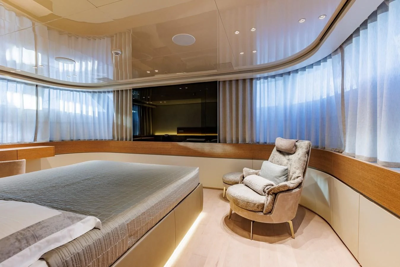 a room with a bed and a chair aboard AMIGA Yacht for Sale