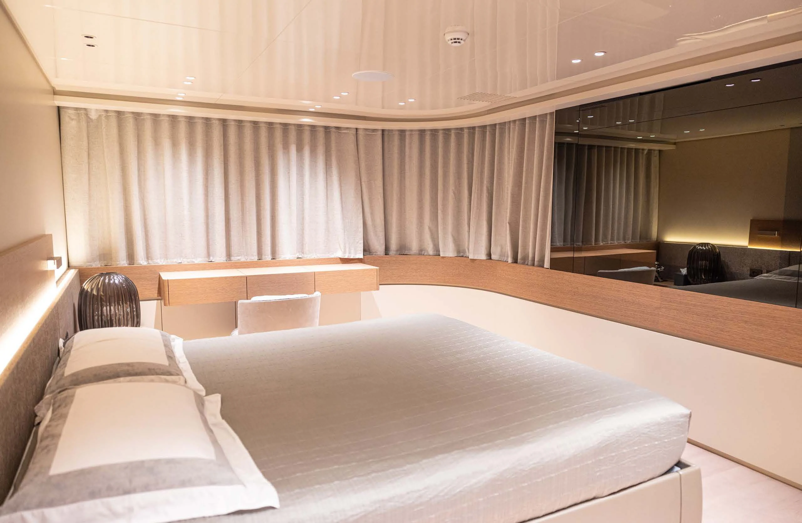a room with a bed and a window aboard AMIGA Yacht for Sale