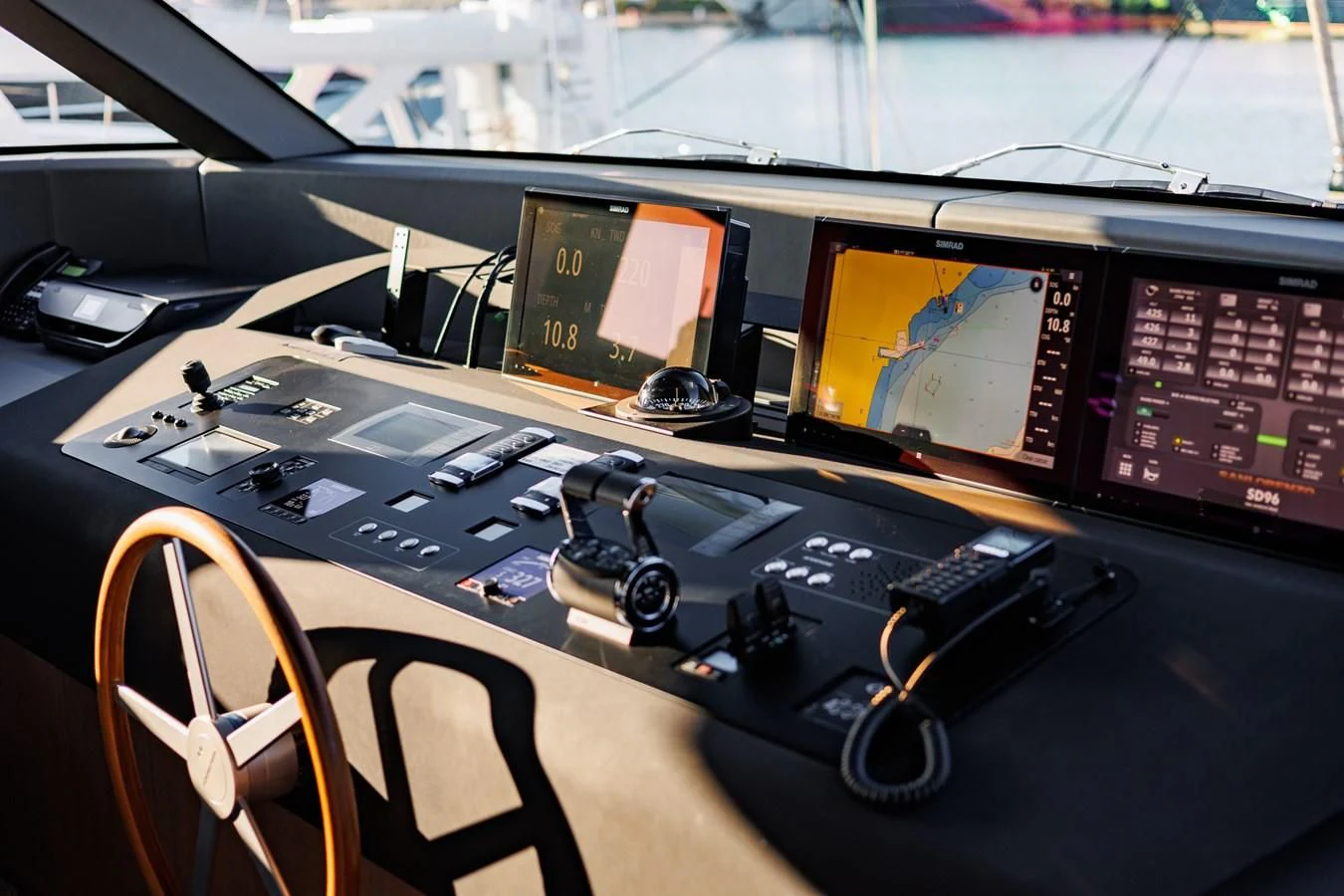 a table with a computer and speakers aboard AMIGA Yacht for Sale