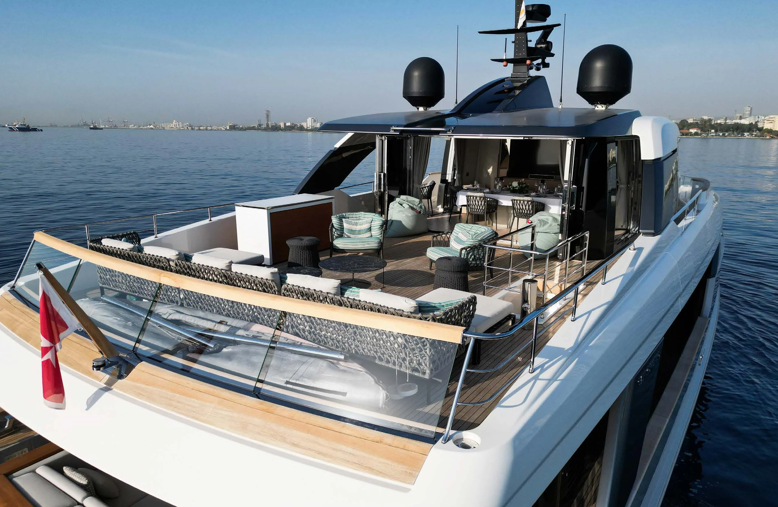 a boat with many chairs on the deck aboard AMIGA Yacht for Sale