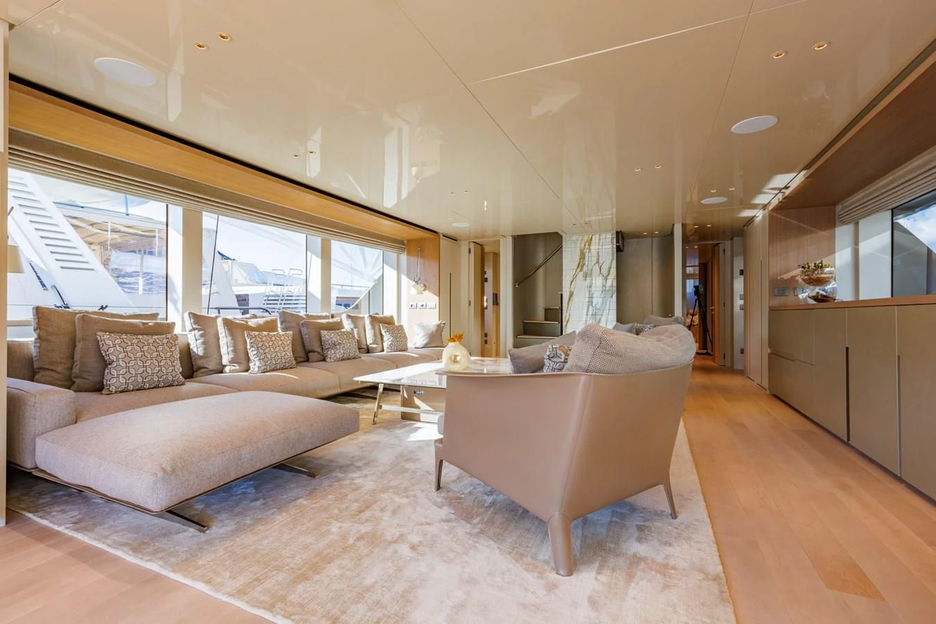 a living room with a couch and a table aboard AMIGA Yacht for Sale