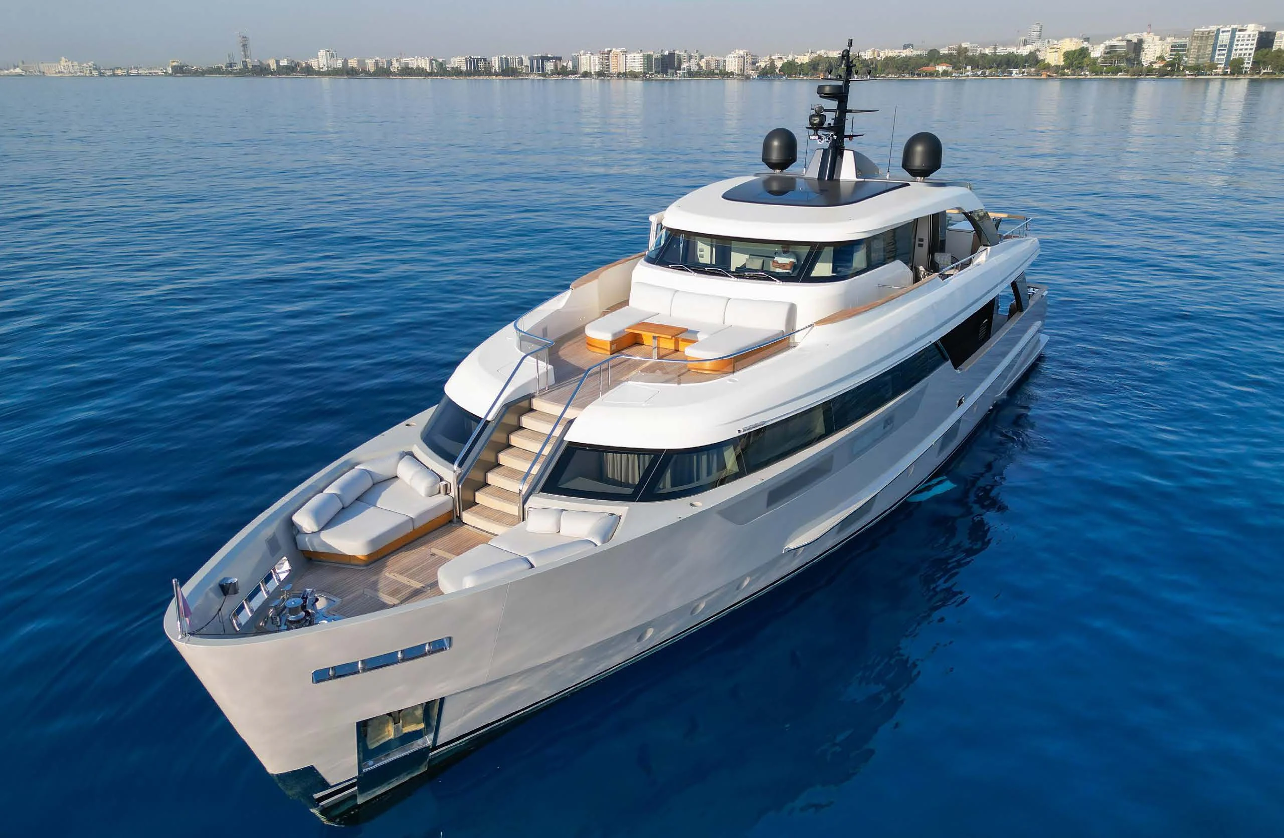 a white boat on the water aboard AMIGA Yacht for Sale