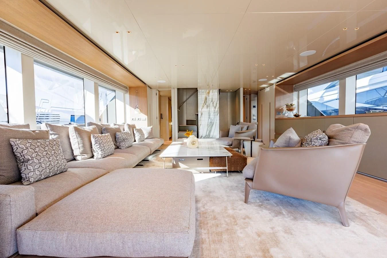 a living room with a couch and a table aboard AMIGA Yacht for Sale