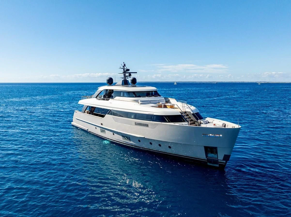 a white yacht in the water aboard AMIGA Yacht for Sale