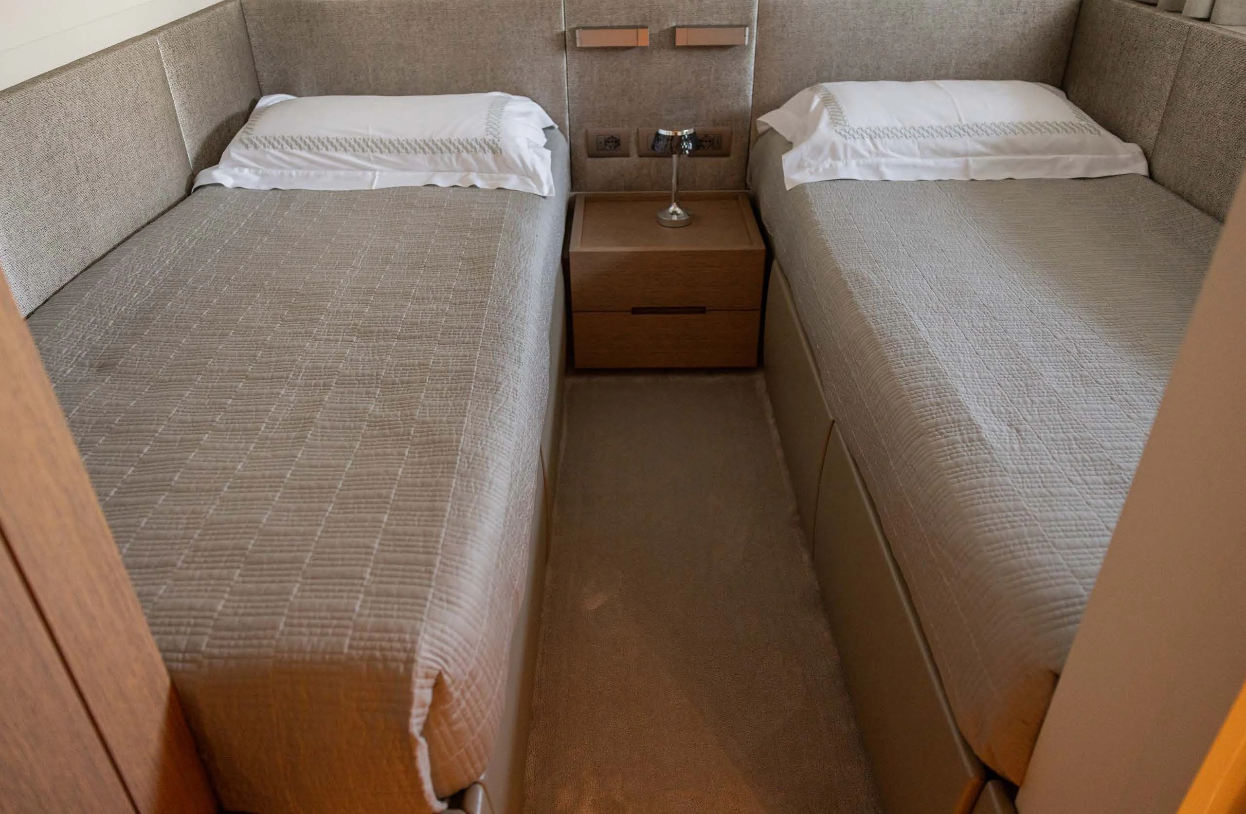 a room with two beds aboard AMIGA Yacht for Sale