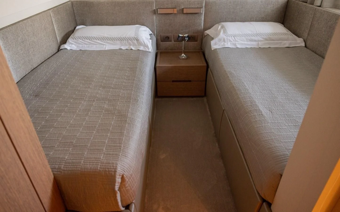 a room with two beds aboard AMIGA Yacht for Sale