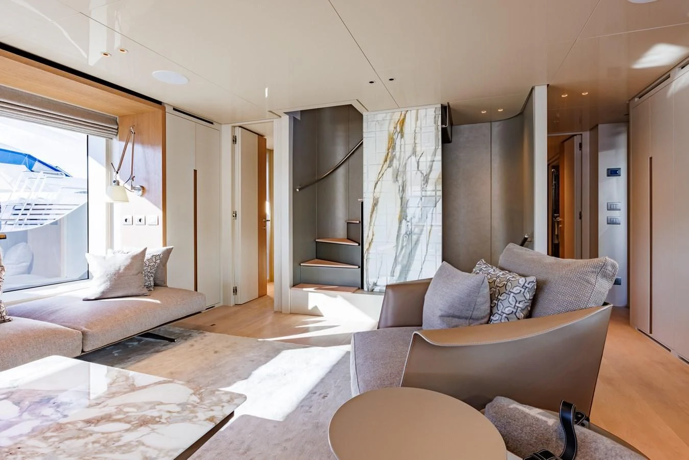 a living room with a couch and a fireplace aboard AMIGA Yacht for Sale