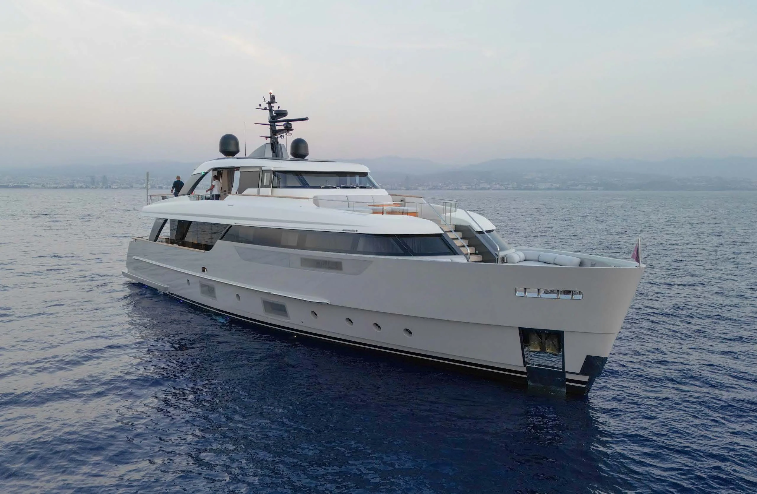a white yacht in the water aboard AMIGA Yacht for Sale