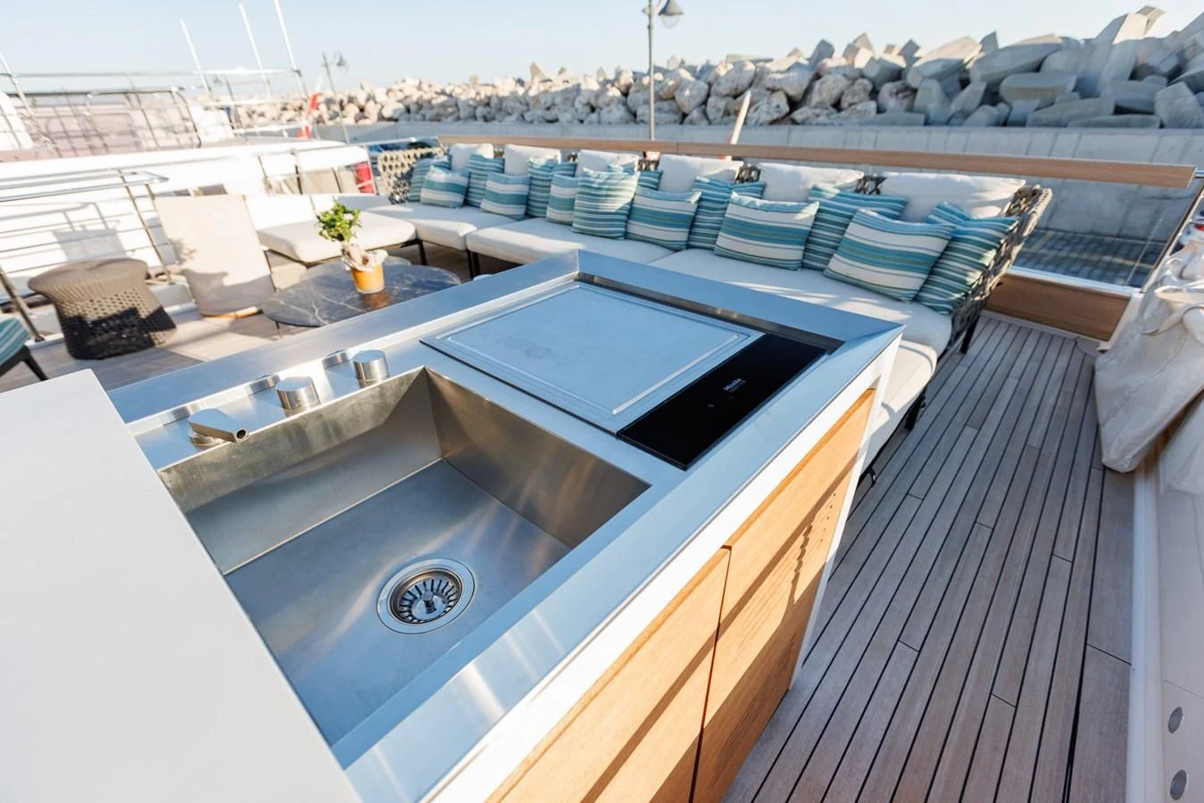 a large pool with a deck aboard AMIGA Yacht for Sale