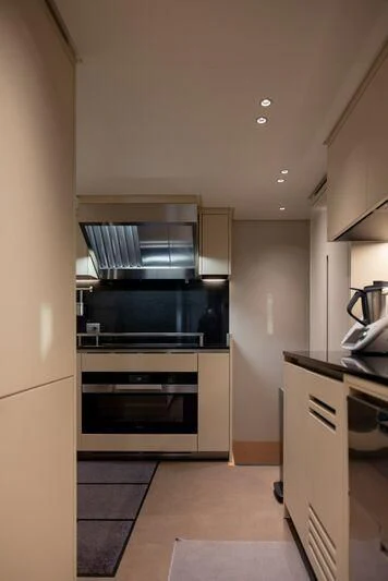 a kitchen with a stove and oven aboard AMIGA Yacht for Sale