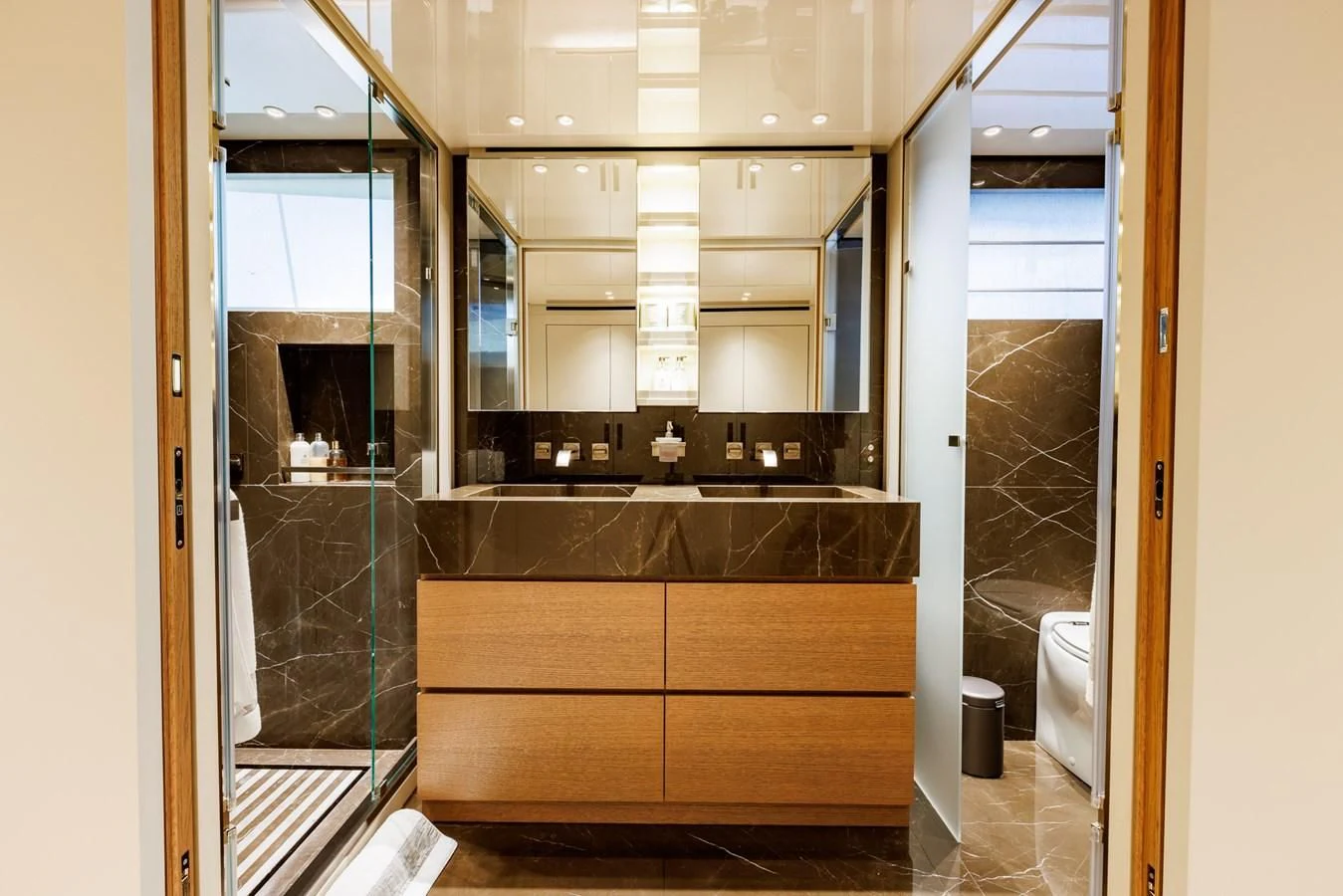 a bathroom with a glass shower aboard AMIGA Yacht for Sale