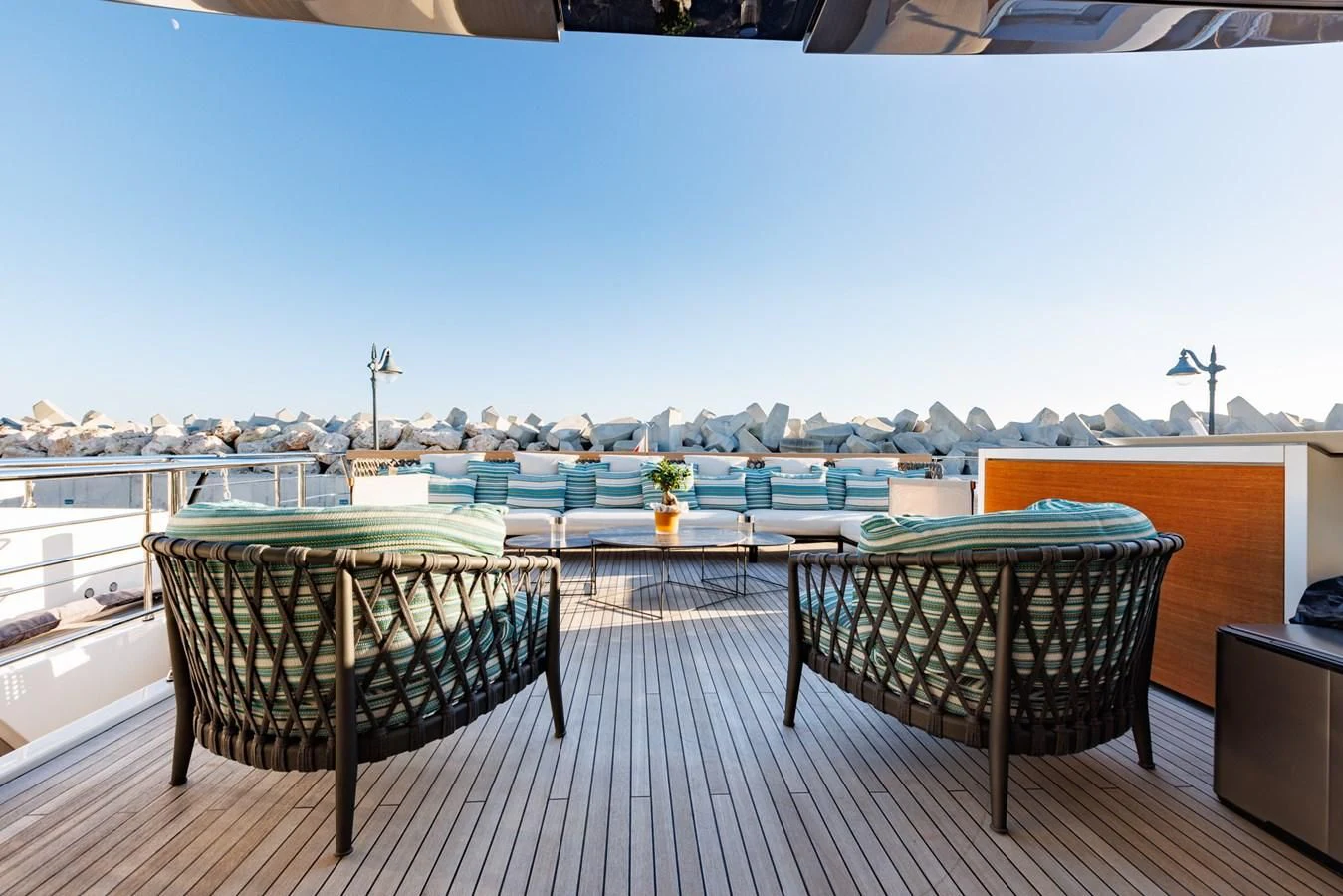 a table and chairs on a deck aboard AMIGA Yacht for Sale