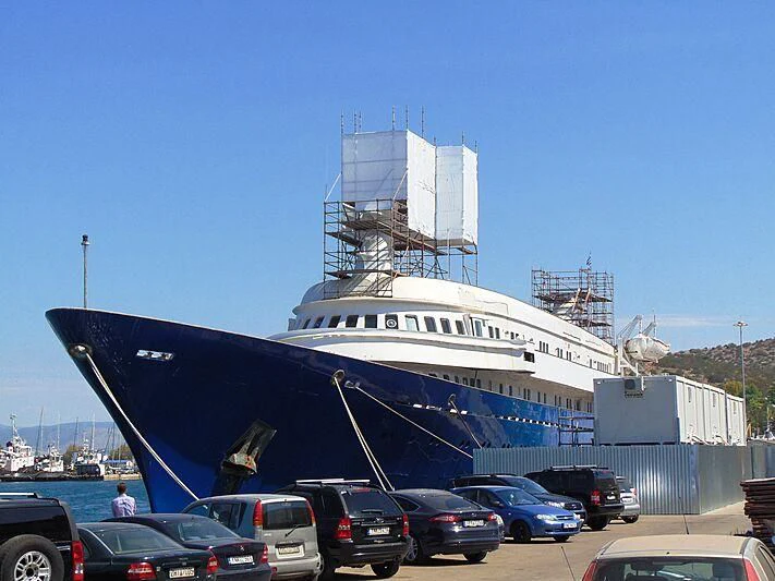 a large ship docked aboard NAVTILVS Yacht for Sale