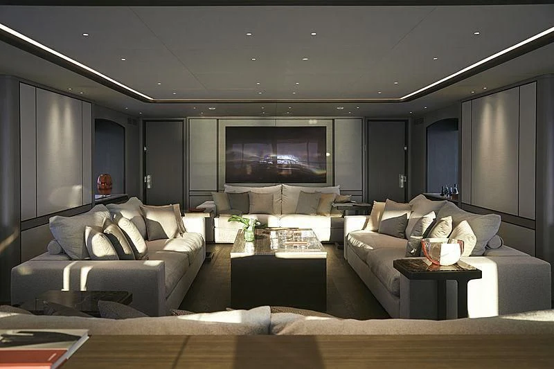 a living room with a large screen aboard ANURAG Yacht for Sale
