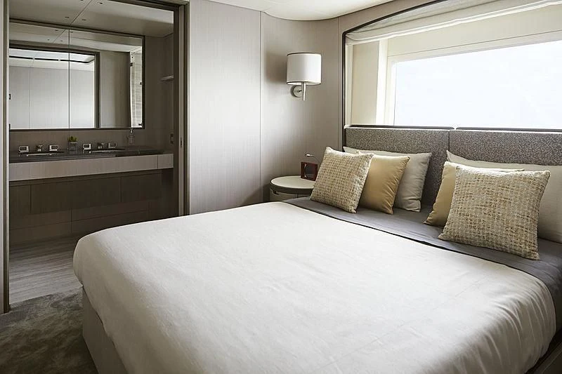 a bed with pillows aboard ANURAG Yacht for Sale