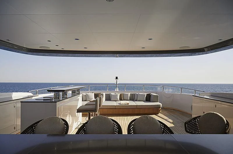 a room with a view of the ocean and the deck aboard ANURAG Yacht for Sale