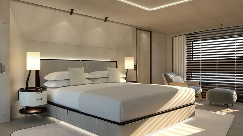 a large bedroom with a bed and a desk aboard ANURAG Yacht for Sale
