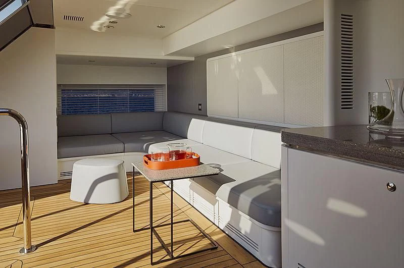 a kitchen with white cabinets aboard ANURAG Yacht for Sale