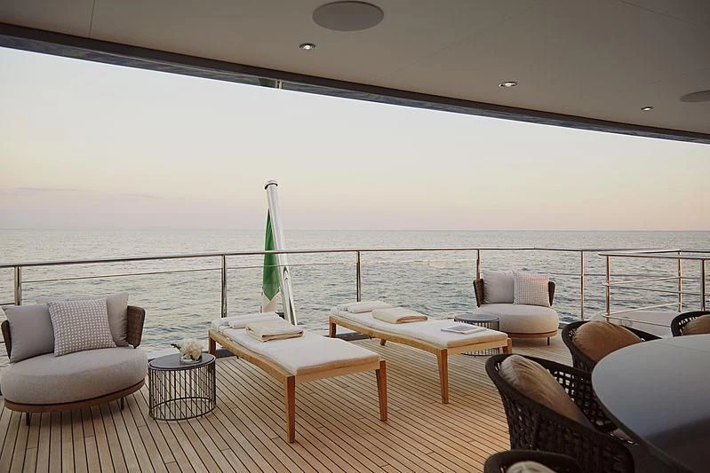 a room with a table and chairs aboard ANURAG Yacht for Sale