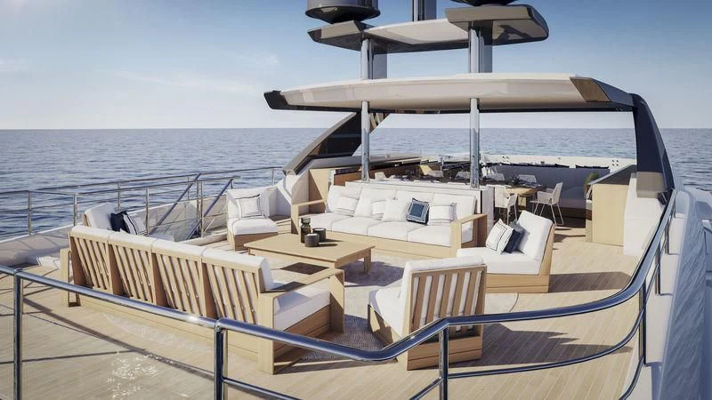 a deck with chairs and a laptop on it aboard ANURAG Yacht for Sale