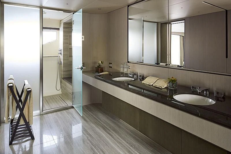 a bathroom with sinks and mirrors aboard ANURAG Yacht for Sale