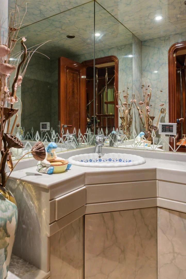 a bathroom with a large mirror aboard ELBA Yacht for Sale