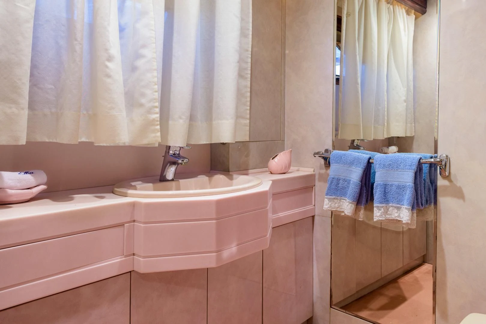 a bathroom with a tub sink and towels aboard ELBA Yacht for Sale