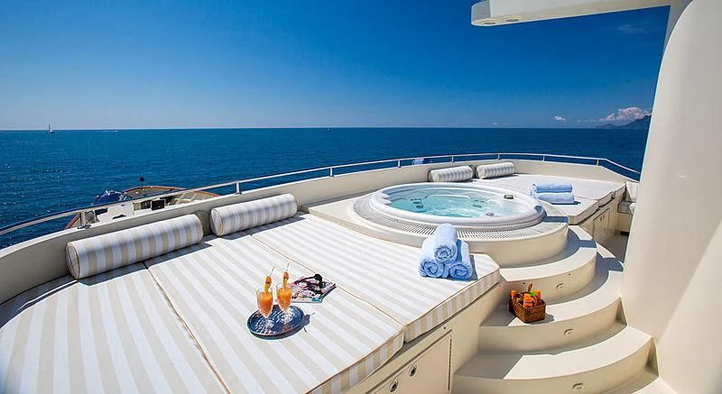 a large white pool on a balcony overlooking the ocean aboard LIBERTA Yacht for Sale