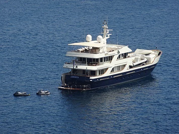 a large boat in the water aboard LIBERTA Yacht for Sale