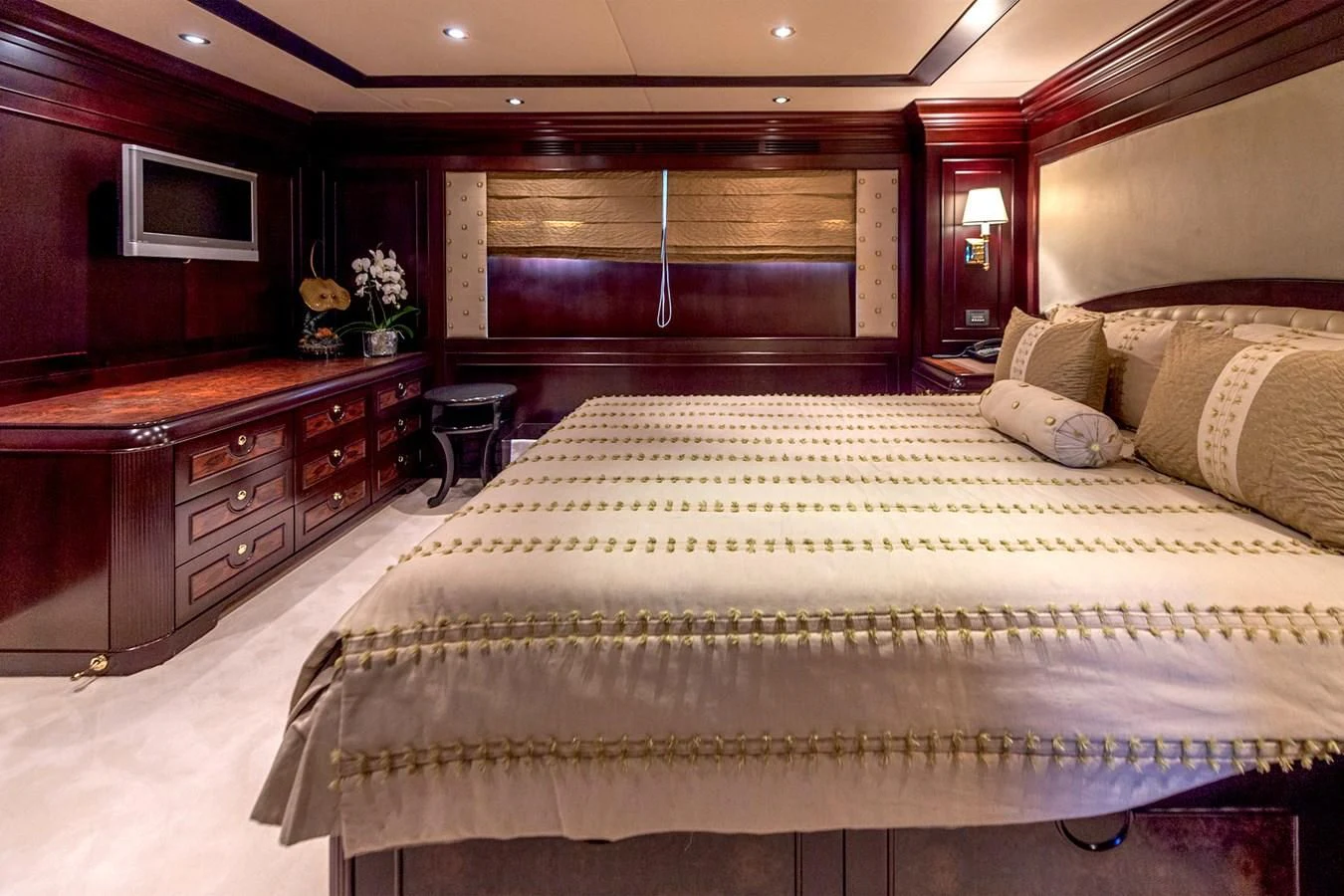 a large bed in a hotel room aboard LIBERTA Yacht for Sale