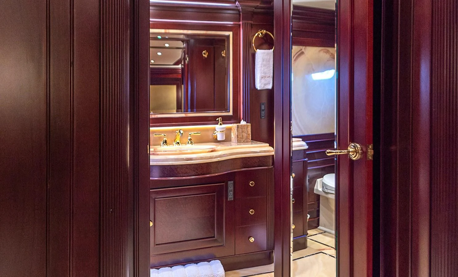 a bathroom with a sink and a mirror aboard LIBERTA Yacht for Sale