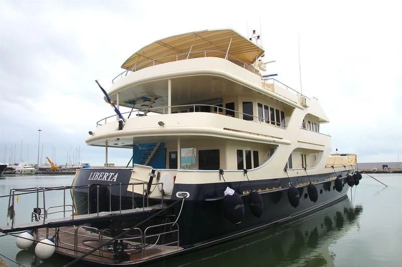 a large boat docked aboard LIBERTA Yacht for Sale
