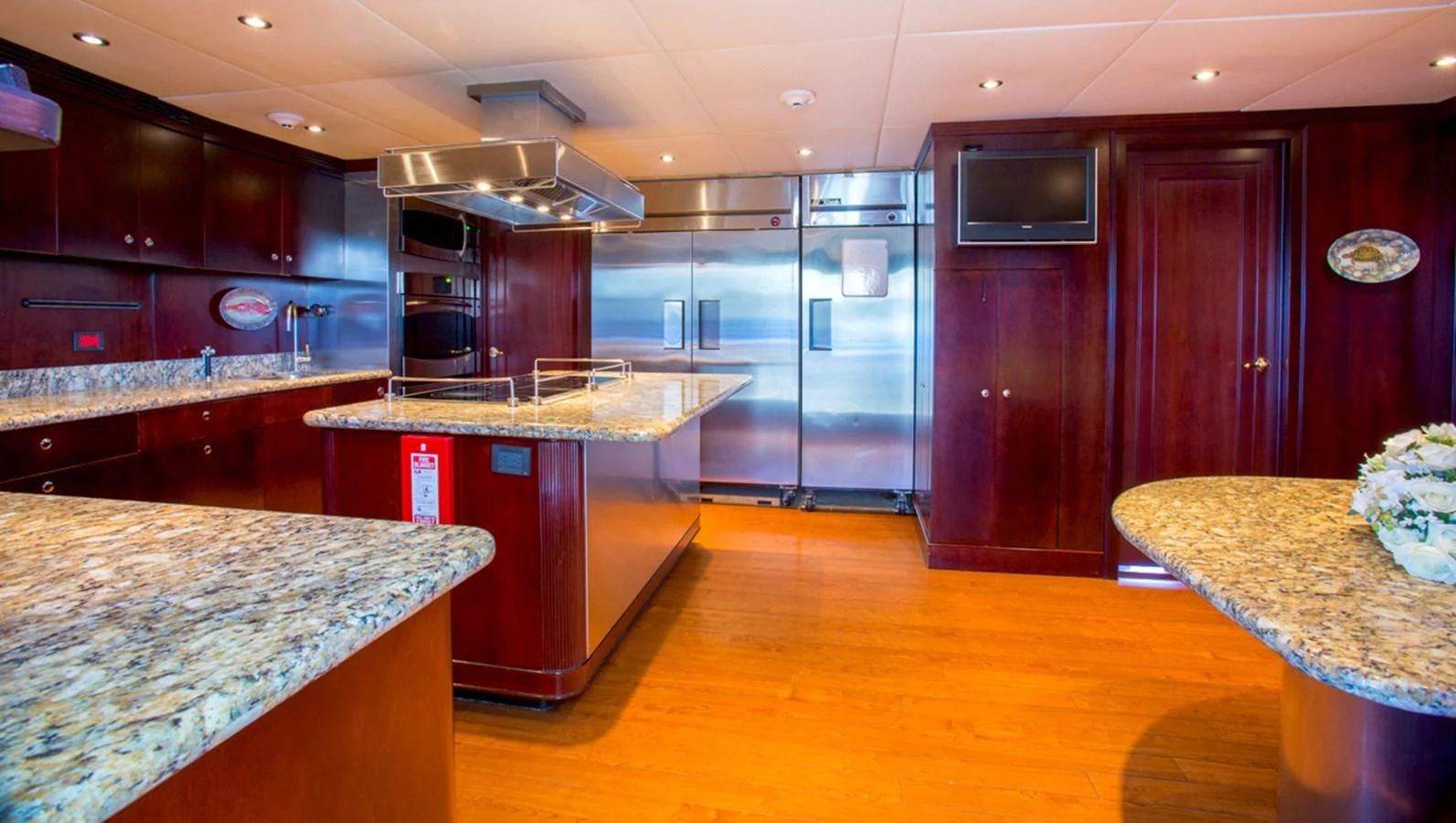 a kitchen with a large island aboard LIBERTA Yacht for Sale