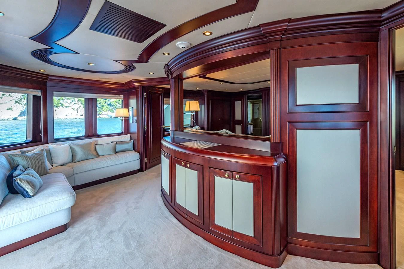 a living room with a wood cabinet aboard LIBERTA Yacht for Sale