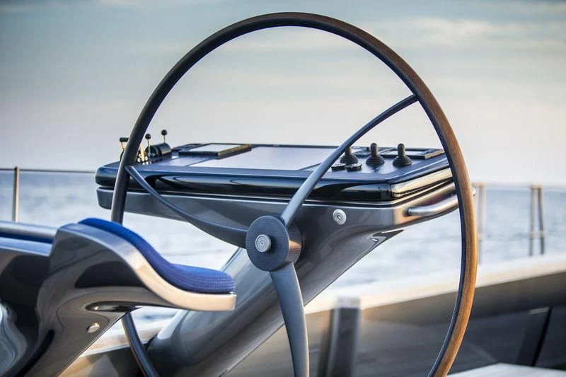 a steering wheel and steering wheel of a boat aboard PATTOO Yacht for Sale