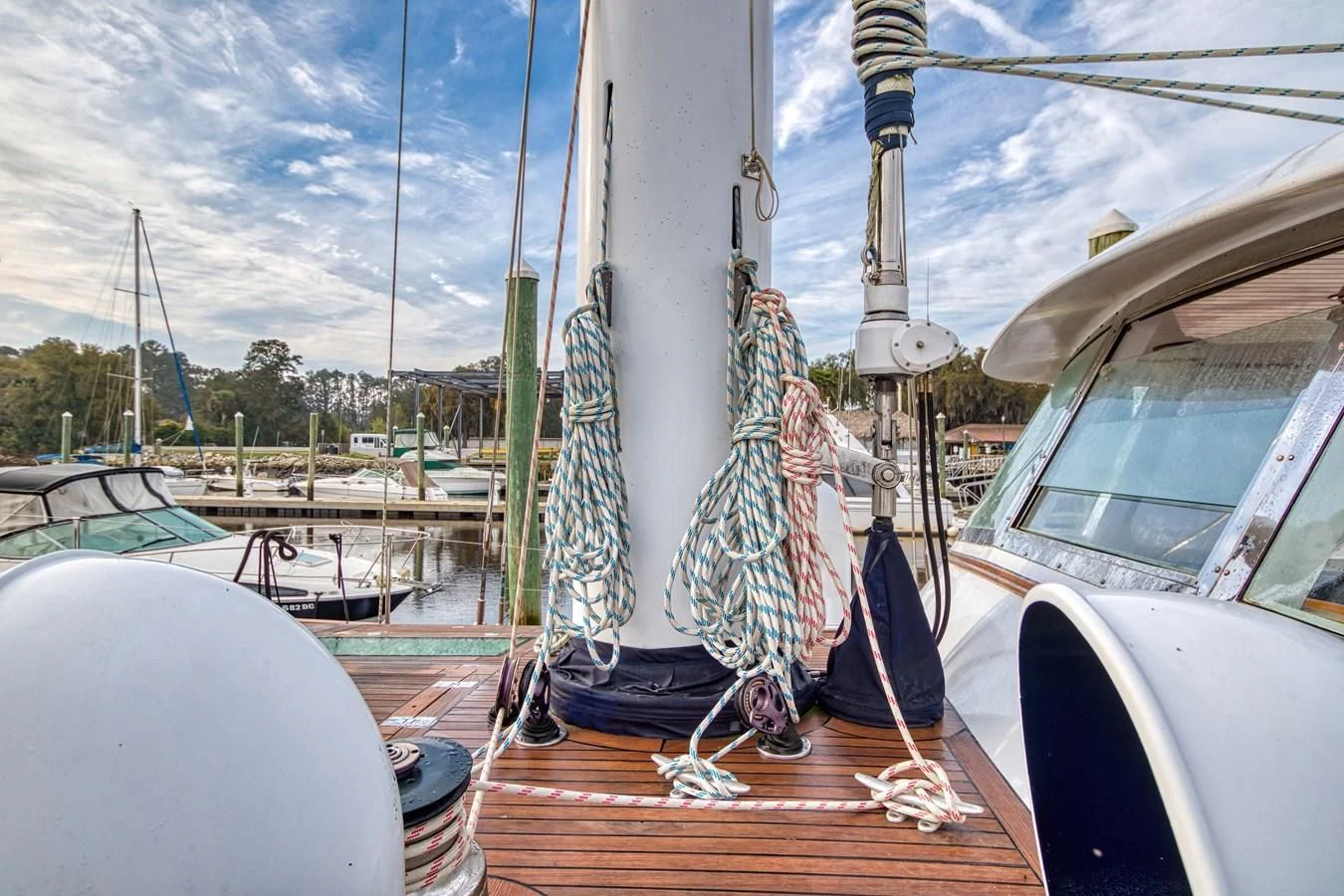 a sailboat on a wooden dock aboard ARIA Yacht for Sale