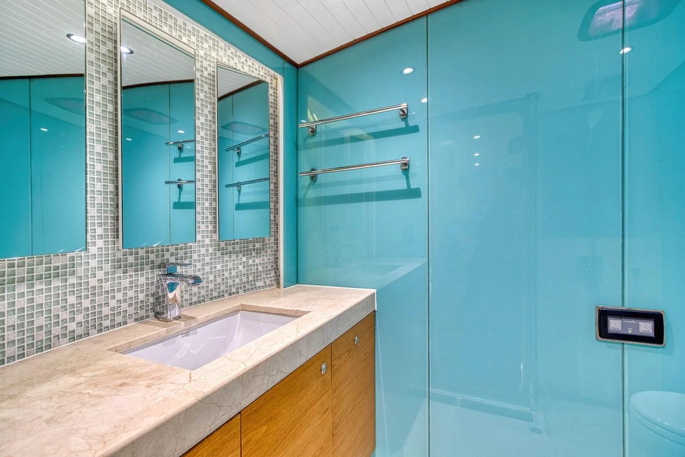 a bathroom with a glass shower aboard ARIA Yacht for Sale