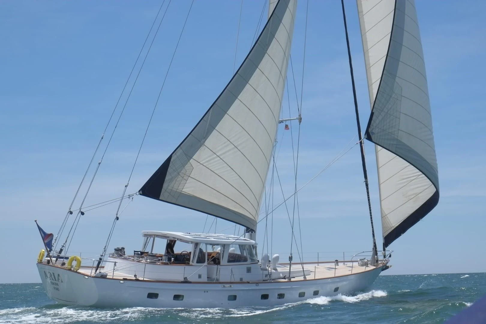 a boat sailing on the sea aboard ARIA Yacht for Sale