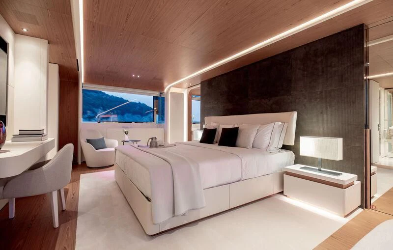 a large bedroom with a large bed aboard LEGEND Yacht for Sale
