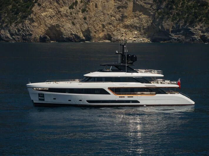 a white yacht on the water aboard LEGEND Yacht for Sale