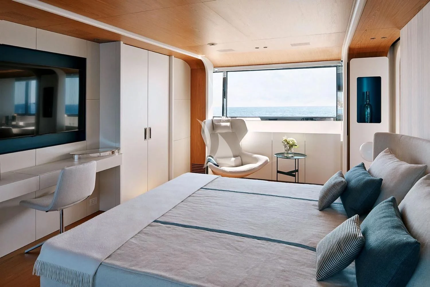 a bedroom with a large bed aboard LEGEND Yacht for Sale