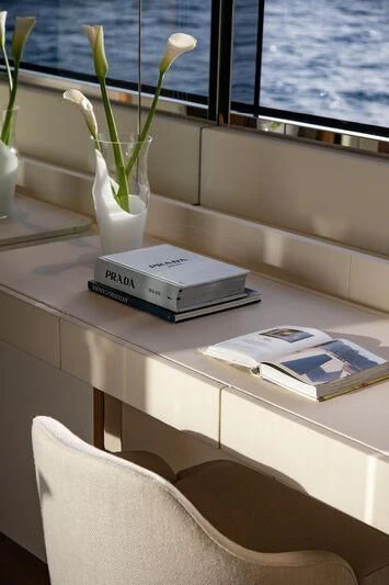 a vase of flowers on a table aboard LEGEND Yacht for Sale