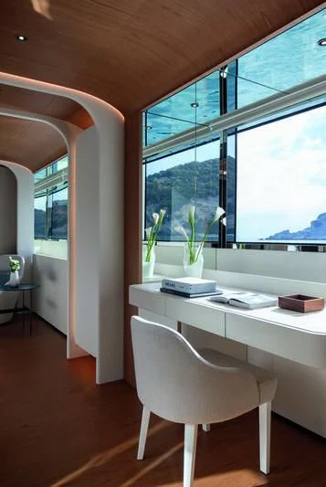 a white chair in a room aboard LEGEND Yacht for Sale