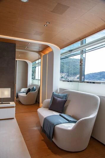 a living room with a large window aboard LEGEND Yacht for Sale