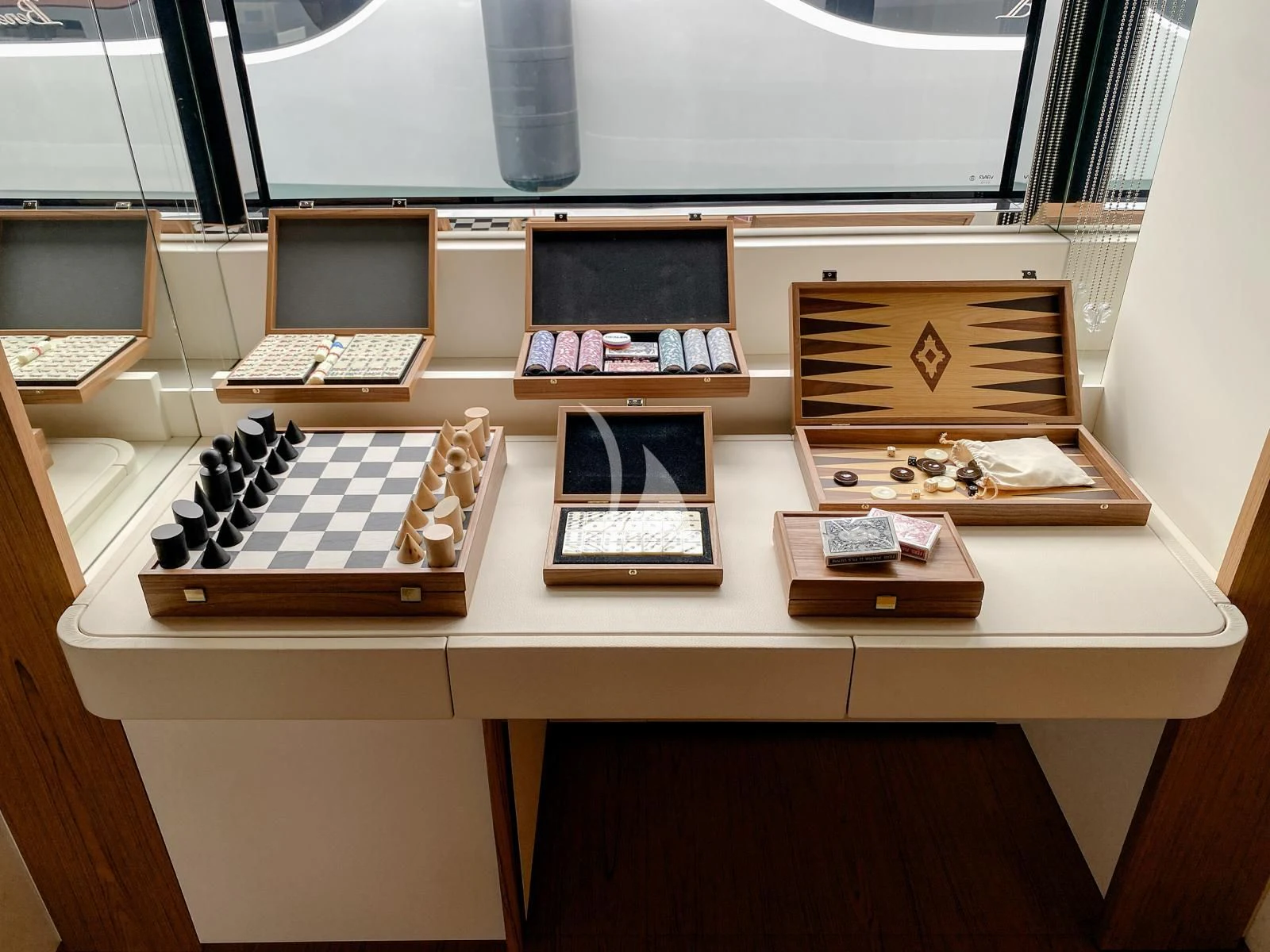 a desk with many laptops on it aboard LEGEND Yacht for Sale