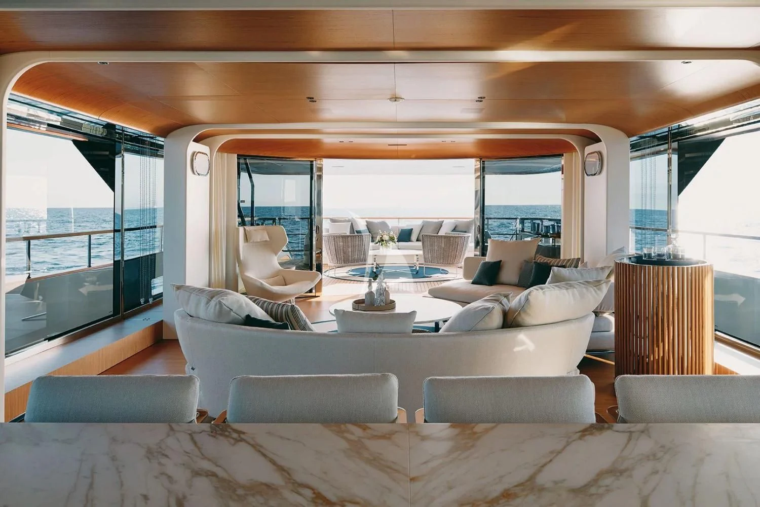 a living room with a large glass window aboard LEGEND Yacht for Sale
