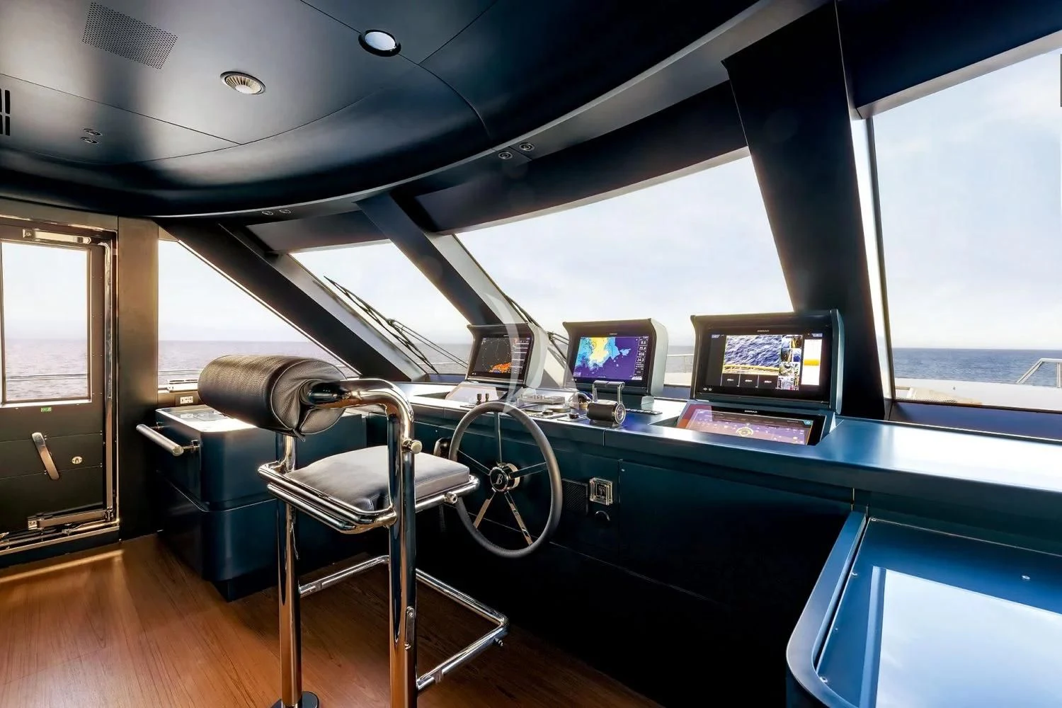 a room with a desk and computer aboard LEGEND Yacht for Sale