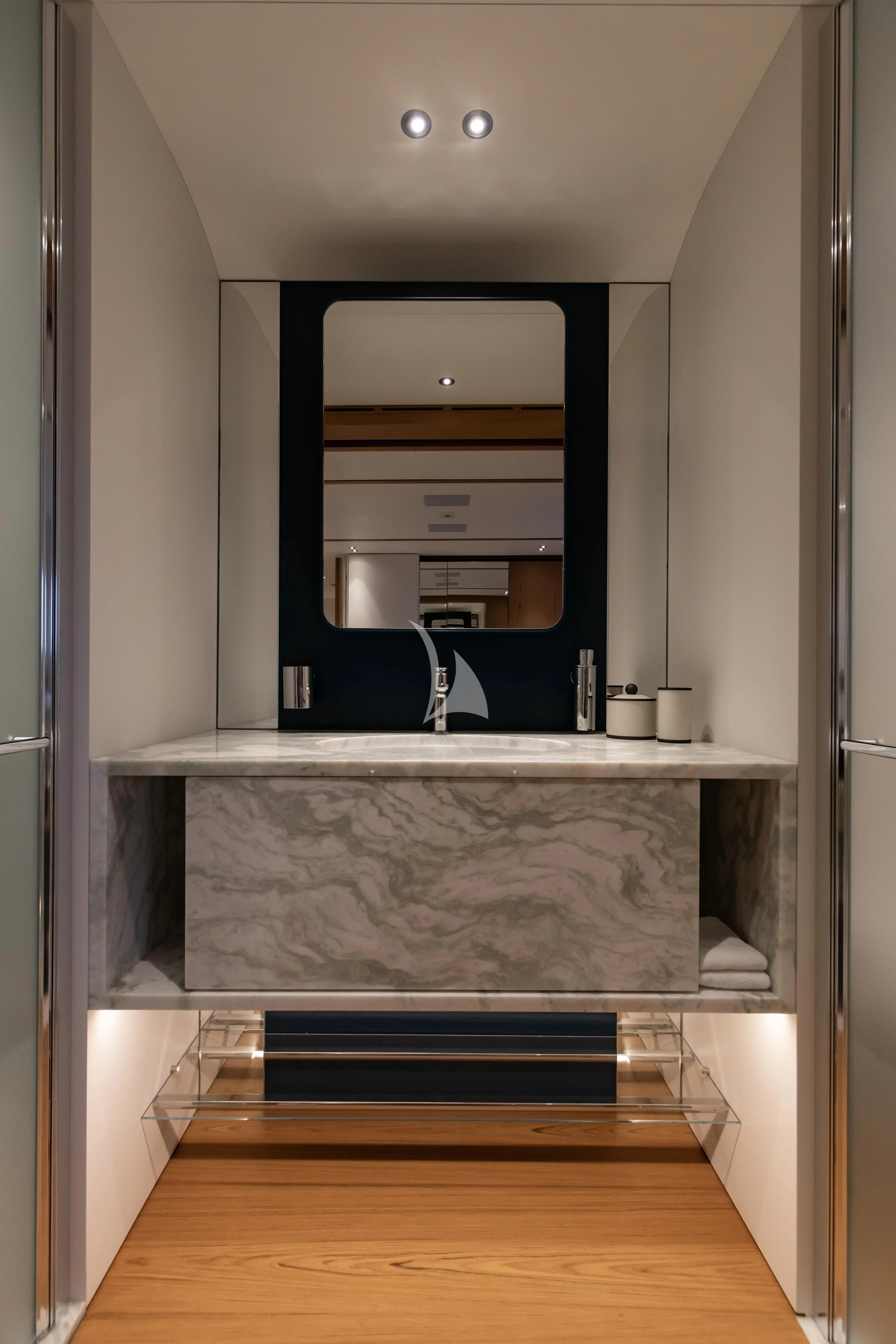 a bathroom with a large mirror aboard LEGEND Yacht for Sale