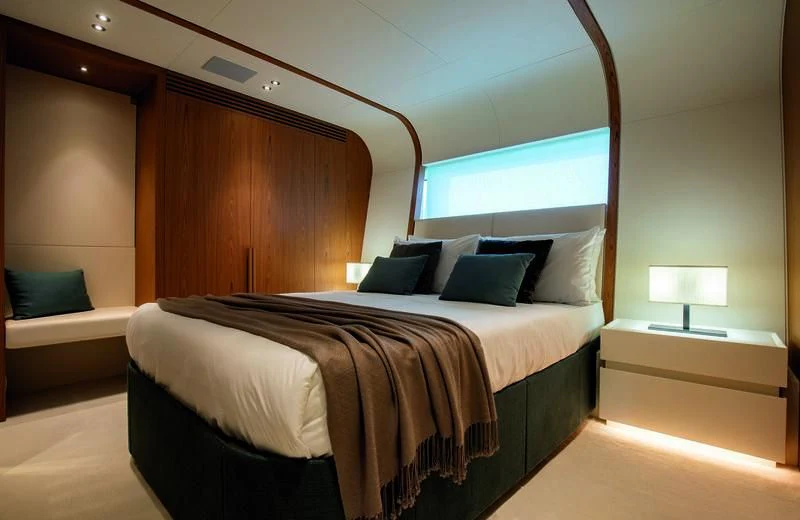 a bed in a room aboard LEGEND Yacht for Sale