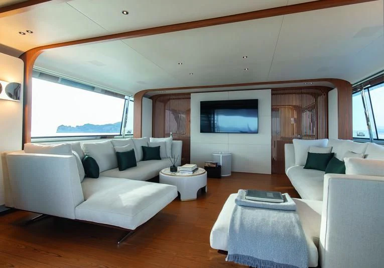 a living room with a large window aboard LEGEND Yacht for Sale